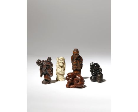 FIVE JAPANESE NETSUKE MEIJI PERIOD AND LATER, 19TH AND 20TH CENTURY One in stag antler carved as Tobosaku Sennin carrying the