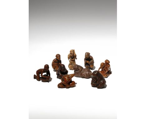 NINE JAPANESE WOOD NETSUKE OF FIGURES MEIJI PERIOD, 19TH CENTURY Variously carved as two drunk shojo sleeping, two men with s