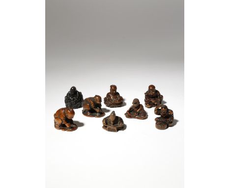 SEVEN JAPANESE WOOD NETSUKE OF FIGURES MEIJI PERIOD, 19TH CENTURY Depicting men engaged in various activities, two polishing 