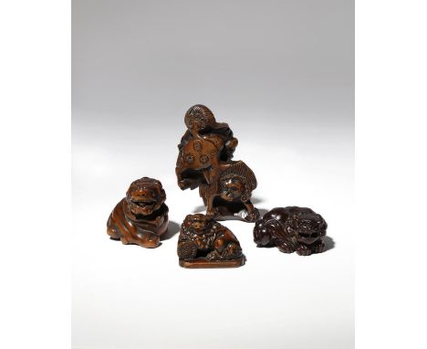 FOUR JAPANESE WOOD NETSUKE EDO PERIOD AND LATER, 18TH CENTURY AND LATER The largest of flattened form with a large peony flow
