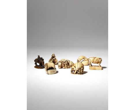 SEVEN JAPANESE IVORY NETSUKE EDO AND MEIJI PERIOD, 18TH AND 19TH CENTURY One carved as a woman with her two children on horse