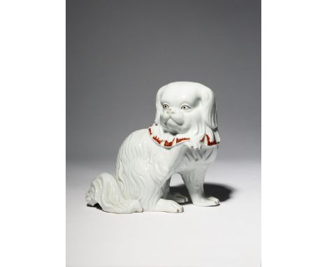 A JAPANESE KUTANI MODEL OF A DOG, OKIMONO MEIJI PERIOD OR LATER, 19TH OR 20TH CENTURY The small Pekingese seated on its haunc