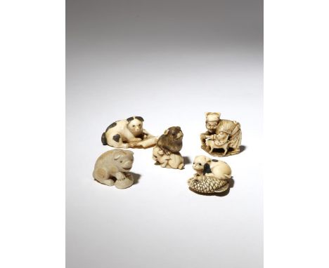 FIVE JAPANESE IVORY NETSUKE OF DOGS MEIJI PERIOD, 19TH CENTURY The first depicting Hanasaka Jiisan with his dog raking throug