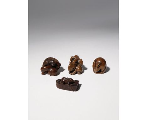 FOUR JAPANESE WOOD NETSUKE EDO PERIOD AND LATER, 18TH CENTURY AND LATER Three depicting rabbits: one in a small boat, signed 