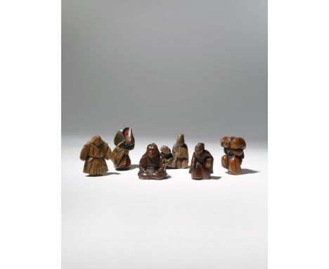 SIX JAPANESE WOOD NETSUKE OF ENTERTAINERS EDO AND MEIJI PERIOD, 18TH AND 19TH CENTURY Two itinerant manzai performers playing