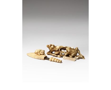 A JAPANESE IVORY OKIMONO AND A LARGE NETSUKE MEIJI PERIOD, 19TH CENTURY The okimono depicting a monkey and a frog on a fruiti