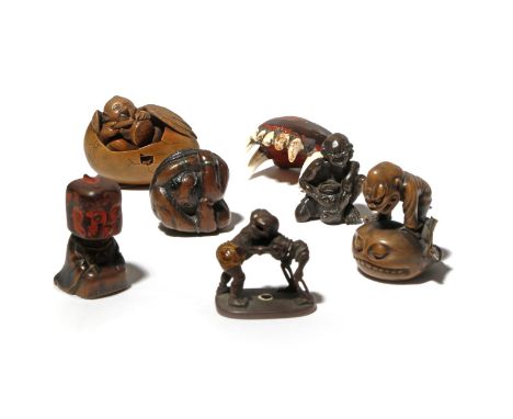 SEVEN JAPANESE NETSUKE MEIJI PERIOD, 19TH CENTURY One made of the lacquered jaw of a small carnivorous animal, possibly a dog
