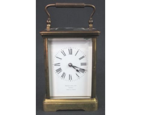 EARLY 20TH CENTURY FRENCH BRASS CARRIAGE CLOCK, having five glass gorge case, full depth enamel dial with Roman numerals, mar