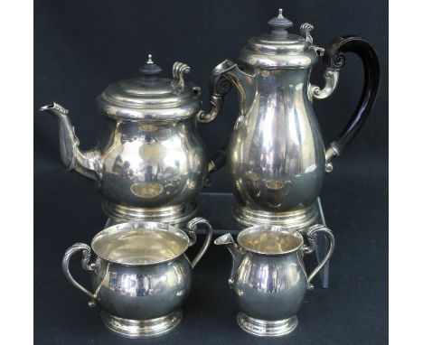 GEORGE V SILVER FOUR PIECE MATCHED TEA AND COFFEE SET comprising teapot; coffee pot; cream jug and two handled sucrier, Londo