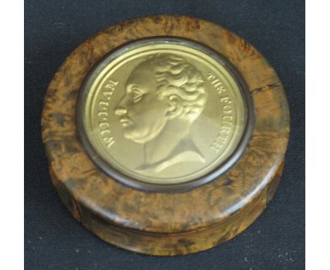 19TH CENTURY TORTOISESHELL LINED BURR WOOD CIRCULAR, CUSHION SHAPED, SNUFF BOX with inset gilded medallion to the cover, 'Wil