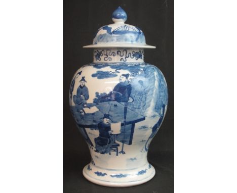 19TH CENTURY CHINESE PORCELAIN BLUE AND WHITE BALUSTER SHAPED VASE AND COVER, overall decorated with various figures in a gar