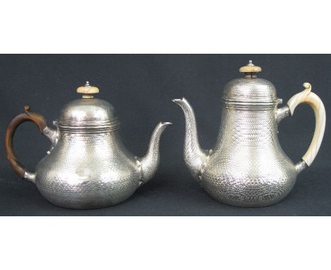 MID VICTORIAN SILVER, ENGINE TURNED, TEAPOT TOGETHER WITH MATCHING COFFEE POT of circular, squat form, London, 1857, maker's 