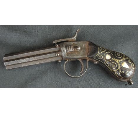 A TURKISH SIX BARREL PERCUSSION PEPPER BOX PISTOL, having 3.75" barrels and gold wirework and mother-of-pearl inlaid hardwood