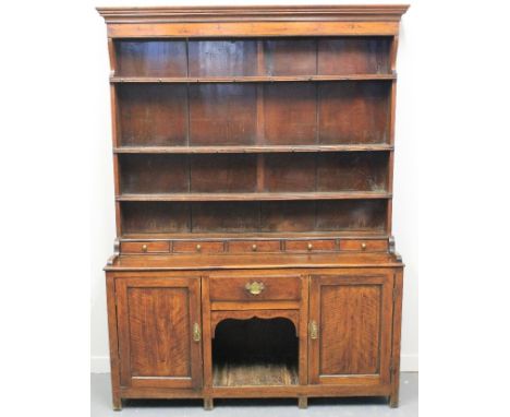 LATE 18TH/EARLY 19TH CENTURY OAK RACK BACKED DRESSER, having five spice drawers above dog kennel flanked by two cupboards, ra