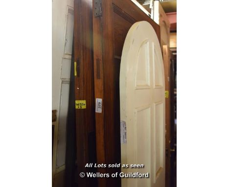 *THREE PITCH PINE PANEL DOORS AND A MODERN ARCHED TOP DOOR