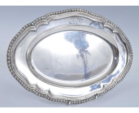 A George II heavy silver dish, of shaped oval form with a stepped gadrooned border, engraved with double-headed eagle and rai