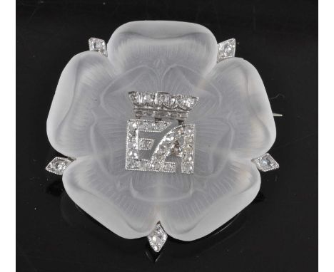 A white metal carved rock crystal Tudor Rose brooch, with the initials EA surmounted by a crown in the centre representing El