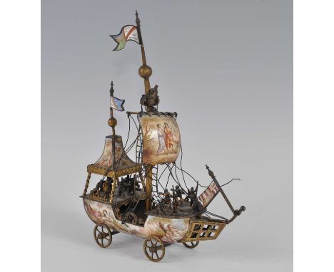 A 19th century gilt and vitreous enamel nef ship, probably Austrian, the canopy, sail and hull enamel decorated with classica