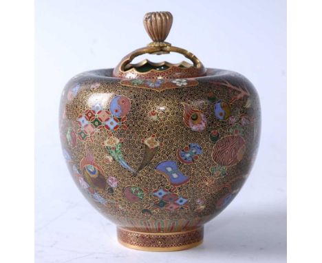 A Japanese Meiji period cloisonné enamel and brass pot pourri jar and cover, of squat baluster form, intricately decorated in