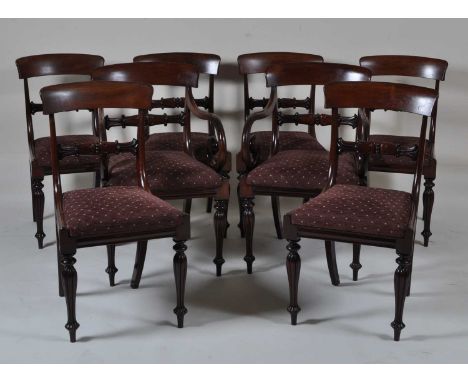 A set of eight William IV mahogany barback dining chairs, each having tulip moulded centre rails, drop-in seats, and raised o