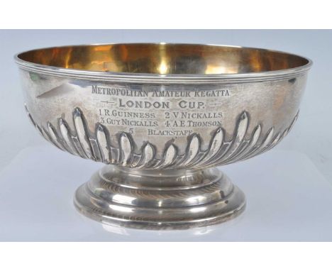 A late Victorian silver trophy bowl, of half-gadrooned circular form, bearing inscription 'METROPOLITAN AMATEUR REGATTA LONDO