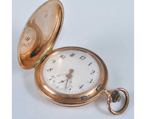 A continental 14ct gold cased gent's full hunter pocket watch, having engine turned covers, unsigned white enamel Arabic dial