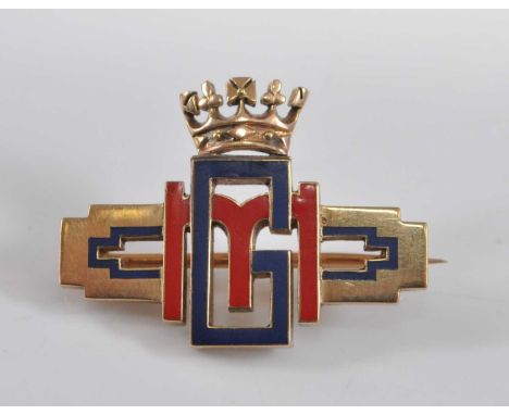 A Cartier yellow metal Royal monogram bar brooch, comprising the initials GM in blue and red enamel detail surmounted by a cr