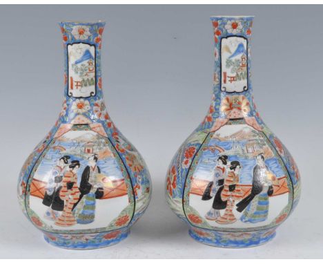 A pair of Japanese Meiji period Arita porcelain bottle vases, each enamel decorated with panels of figures before a mountain 