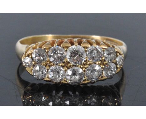 A late Victorian 18ct yellow gold diamond two-row half hoop eternity ring, featuring twelve graduated Old European cut diamon