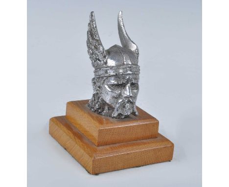 A Rover Viking head chrome car mascot, h.9cm, all raised on oak plinth