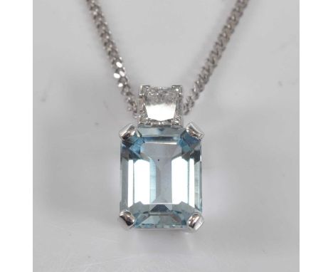 A white metal, aquamarine and diamond pendant, featuring a rectangular cut aquamarine suspended below a princess cut diamond,