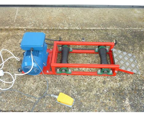 A Universal Motors 240v Motorcycle Roller Pit Starter with foot operated switch.