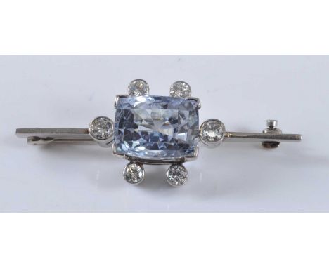A white metal, synthetic spinel and diamond bar brooch, featuring a central rectangular cut synthetic spinel surrounded by si