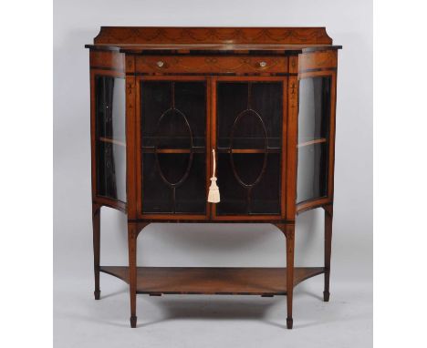A Sheraton Revival satinwood and inlaid china display cabinet, the raised back and frieze penwork decorated with floral swags