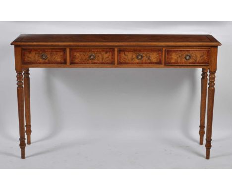 An oak and burr oak hall table, in the 18th century style, having four crossbanded frieze drawers and raised on ring turned s