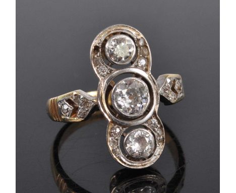 A yellow and white metal diamond lozenge shaped panel ring, comprising three graduated Old European cut diamonds within a bor