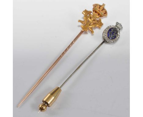 Two stick pins, one comprising the monogram VE against a blue enamel background with oval surround set with twenty rose cut d