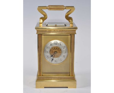 A circa 1900 lacquered brass carriage clock, having a silvered convex Arabic chapter ring, visible platform escapement, the t