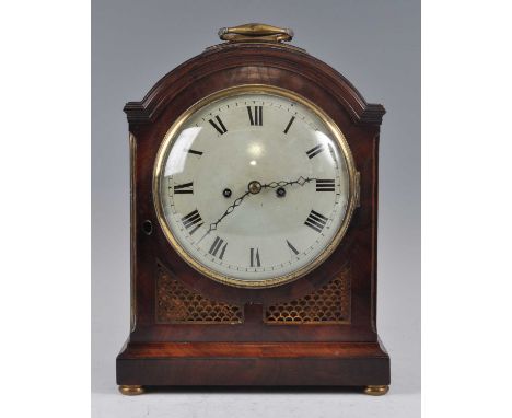 An early 19th century mahogany bracket clock, having an unsigned convex white enamel Roman dial, twin winding holes for an ei