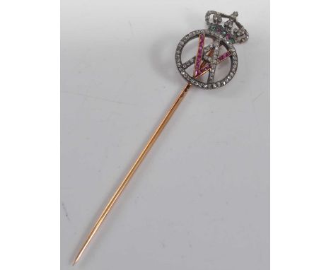 A yellow metal Royal monogram stick pin, comprising the initials VA within an orb surround set with eighty-one 1 to 0.8mm ros