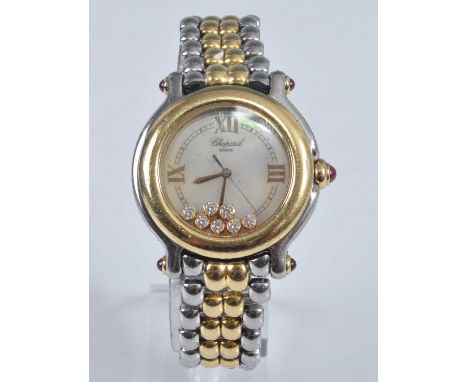 A ladies Chopard bi-metal Happy Sport wristwatch, the signed dial set with seven floating diamonds, total diamond weight esti