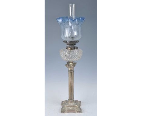 A Victorian silver plated oil lamp, having an acid etched blue tinted glass shade and cut glass font above a fluted silver pl