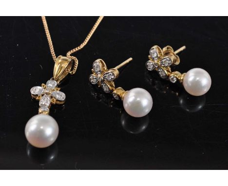 An 18ct yellow gold, pearl and diamond pendant and earring set, the pendant comprising an 8mm cultured pearl suspended below 