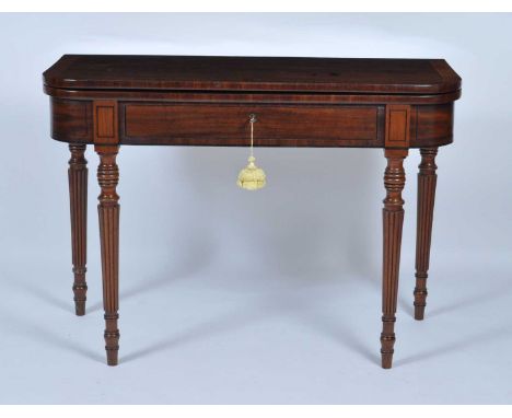 An early 19th century mahogany tea table, having a boxwood and ebony strung crossbanded fold-over top with swivel action, abo