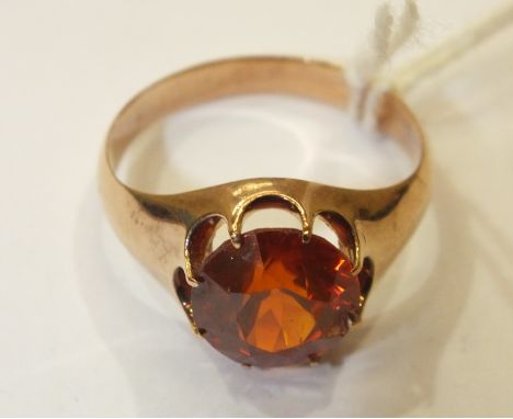 A 9ct gold ring set orange zircon (chipped), size P, 5g.