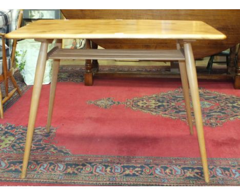 An Ercol breakfast table, the rectangular top above an open shelf, on splayed, turned and tapered legs, 100 x 70cm.