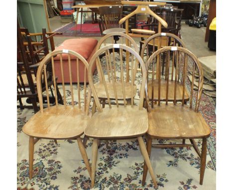 Three Ercol hoop spindle-back chairs, two others and a light-wood valet.