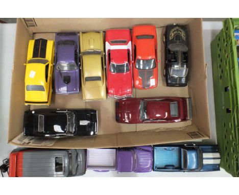A collection of eleven unboxed mainly 1960's model cars, 1/18th and other scales, (11).