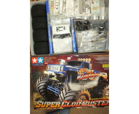 A Tamiya "Super Clod Buster" 1/10th scale R/C 4x4x4 pick-up truck, boxed, (unused).