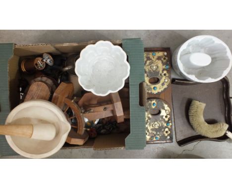 A pestle and mortar, two ceramic jelly moulds, a terracotta model of an otter, (a/f) and other items.